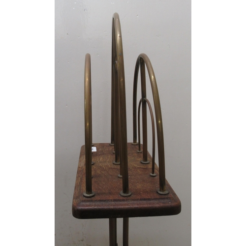 238 - A mid 20thC tubular framed, two division magazine rack, raised on splayed legs  32