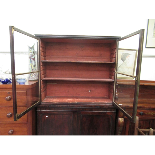 258 - A George III rosewood veneered cabinet bookcase, the upper section with two glazed doors, over a pai... 