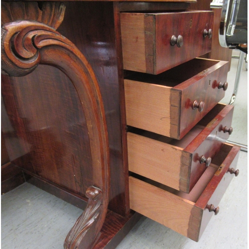 260 - A mid Victorian crossbanded mahogany and walnut Davenport with a hinged lidded compartment, over a t... 