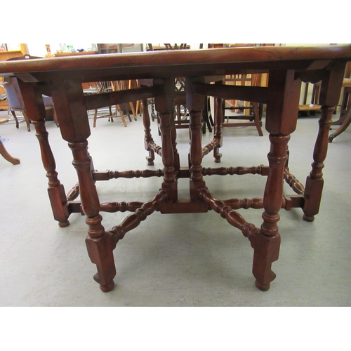 296 - A modern yewwood drop leaf/wake table, raised on turned baluster and block supports  29