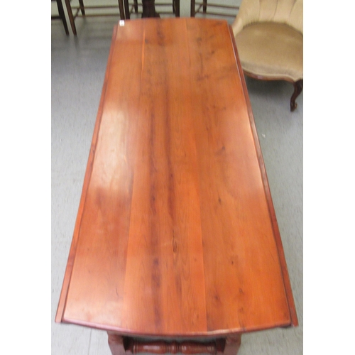 296 - A modern yewwood drop leaf/wake table, raised on turned baluster and block supports  29