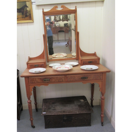 297 - An Edwardian bleached mahgoany and walnut finished dressing table, surmounted by a mirror, over an a... 