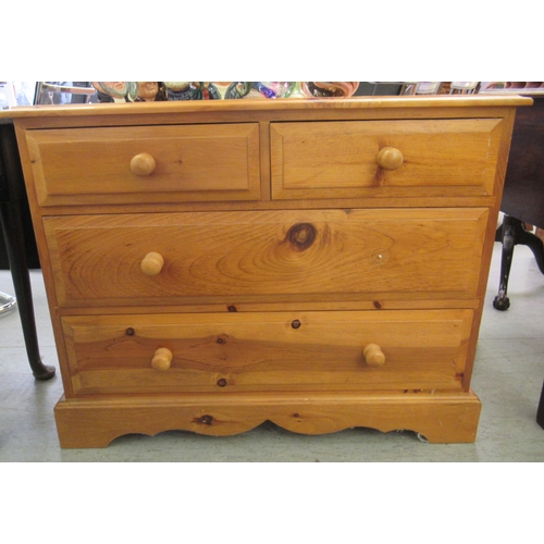 300 - A modern pine four drawer dressing chest, raised on bracket feet  28.5