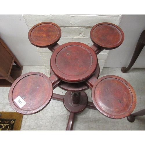 301 - Small 20thC furniture: to include a mahogany pedestal cake stand with a Lazy Susan action, five dish... 