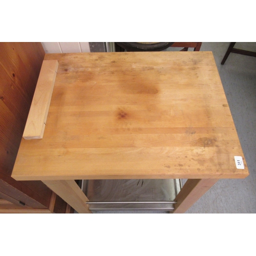 311 - A modern beech butchers block, raised on square legs, united by a steel undershelf  33