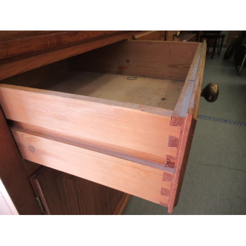 313 - A modern waxed pine dresser, the superstructure with two open plate rack shelves, over three frieze ... 