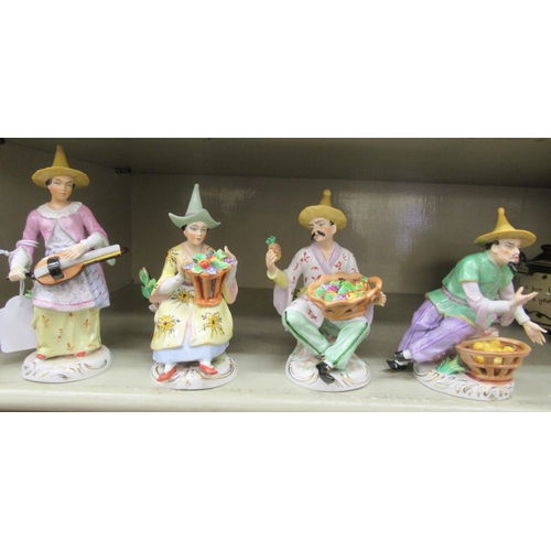 326 - A series of four early 20thC Sitzendorf porcelain figures, featuring Chinese men and women  largest ... 