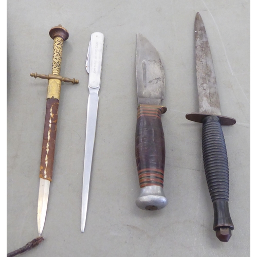 329 - Edged weapons: to include a Kukri, the curved blade 12