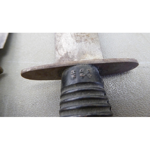 329 - Edged weapons: to include a Kukri, the curved blade 12