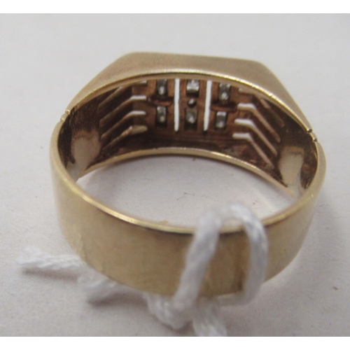 332 - A yellow metal signet ring, set with eleven diamonds  stamped 9c