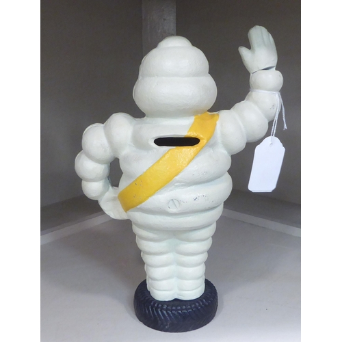 334 - A cast iron money box, The Michelin Man  9