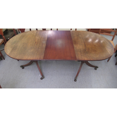 59 - A Regency mahogany twin pedestal dining table  31