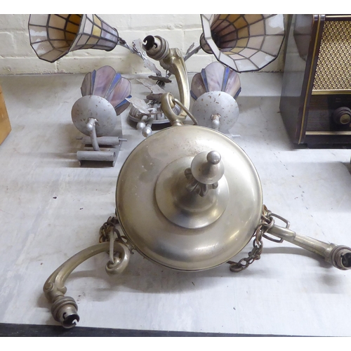 62 - Early 20thC lighting, in stylised silvered fittings: to include two pairs of wall lamps with coloure... 