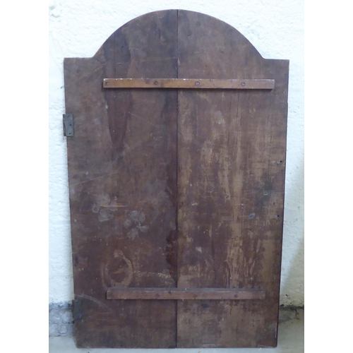 65 - Late 19th/early 20thC wooden architectural salvage: to include a carved pitch pine Gothic arch  24