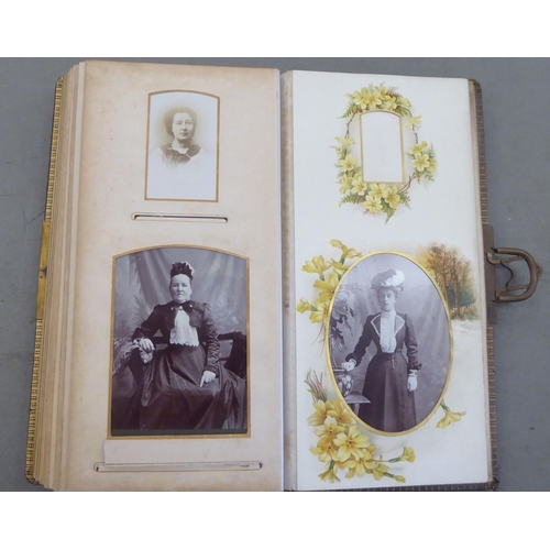 70 - A late Victorian leather bound carte de viste album, containing portraits