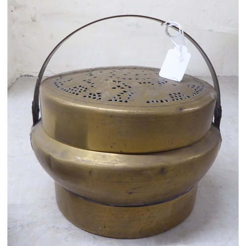 72 - Two Chinese cast metal food containers 