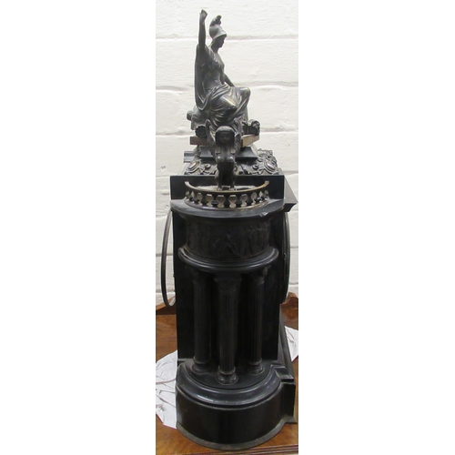 76 - A late Victorian black slate mantel clock of architectural form, surmounted by gilt metal figures; t... 