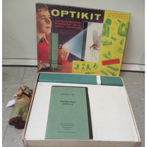 85 - An Optikit Projector kit  boxed; and a clockwork fabric covered toy monkey  7