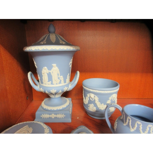 87 - Wedgwood powder blue jasperware items: to include a twin handled pedestal vase and cover  11.5