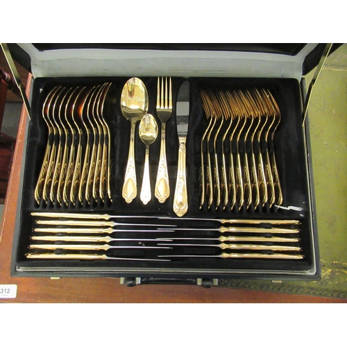 96 - A gold plated stainless steel Solingen canteen of cutlery and flatware, in a combination coded, fitt... 