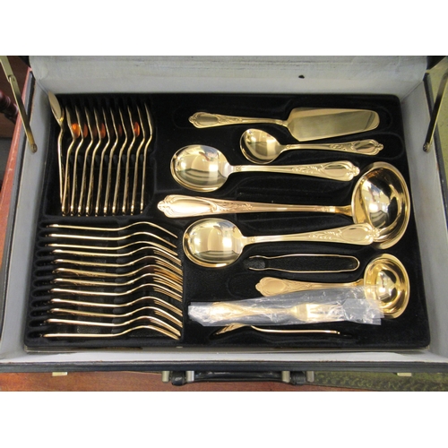 96 - A gold plated stainless steel Solingen canteen of cutlery and flatware, in a combination coded, fitt... 