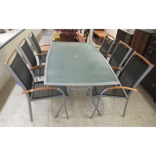 16 - A modern terrace set, comprising a grey enamel metal framed table with semi-opaque glass top, raised... 