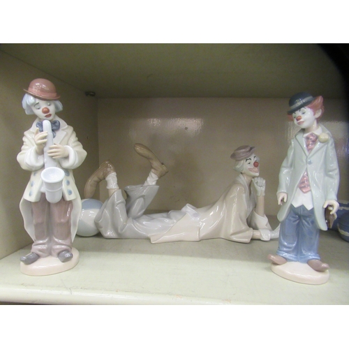 2 - Three Lladro porcelain figures, clowns in various poses  largest 8