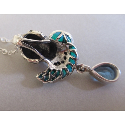 20 - A silver coloured metal plique a jour necklace and pendant, set with blue topaz