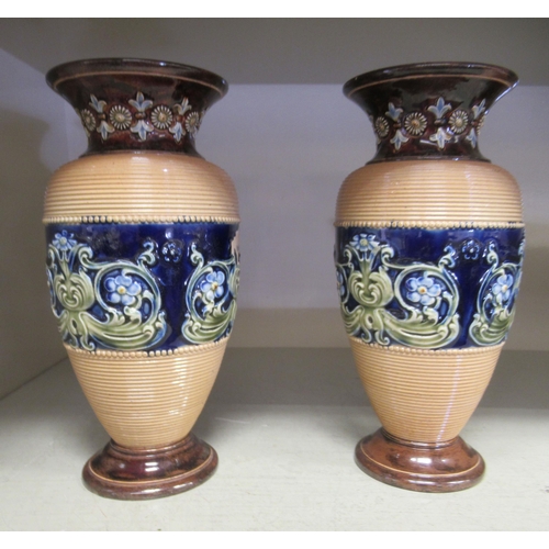 1 - A pair of Doulton Lambeth blue, brown and green glazed stoneware baluster shape vases with flared ri... 