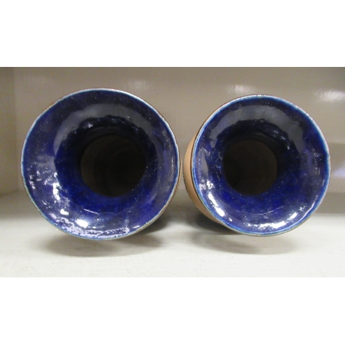 1 - A pair of Doulton Lambeth blue, brown and green glazed stoneware baluster shape vases with flared ri... 