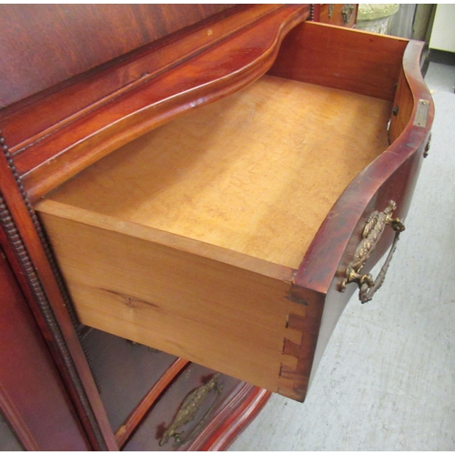 101 - An Edwardian mahogany display cabinet, comprising an arrangement of full height lead glazed doors an... 