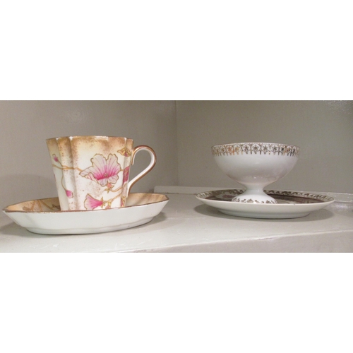 104 - Decorative china cabinet cups and saucers: to include a Royal Worcester example  with fruiting trees... 