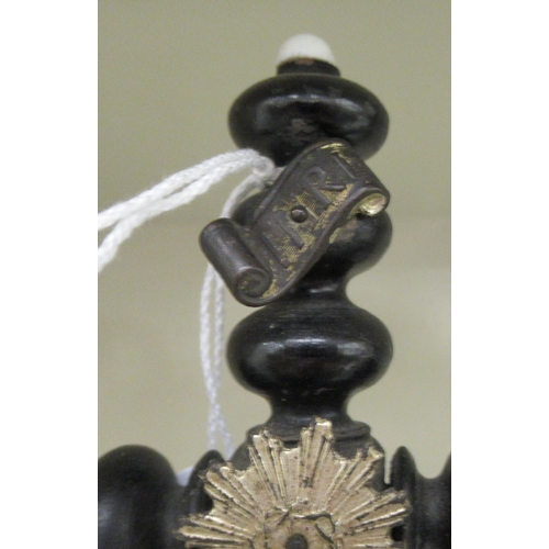 24 - A late 19thC Continental turned and ebonised wooden crucifix, the cross entwined by a serpent  ... 