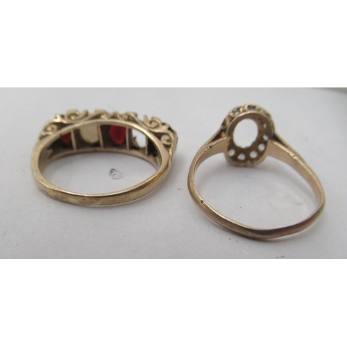 259 - Two 9ct gold rings, one set with garnets, the other white stones