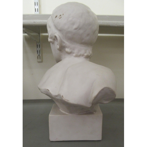 263 - A 20thC moulded ceramic faux marble bust, a youth, on a block socle  17.5