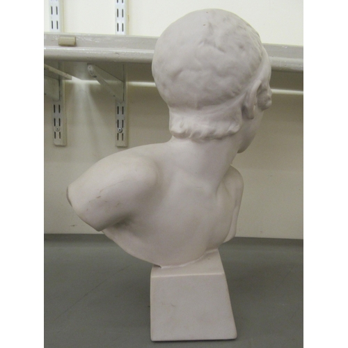 263 - A 20thC moulded ceramic faux marble bust, a youth, on a block socle  17.5