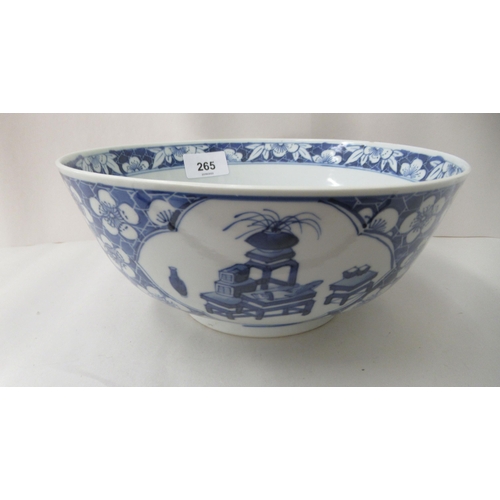 265 - A 19thC Chinese porcelain bowl, decorated with figures and flora  bears a four character mark  8.5