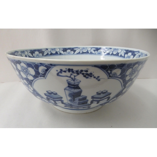 265 - A 19thC Chinese porcelain bowl, decorated with figures and flora  bears a four character mark  8.5