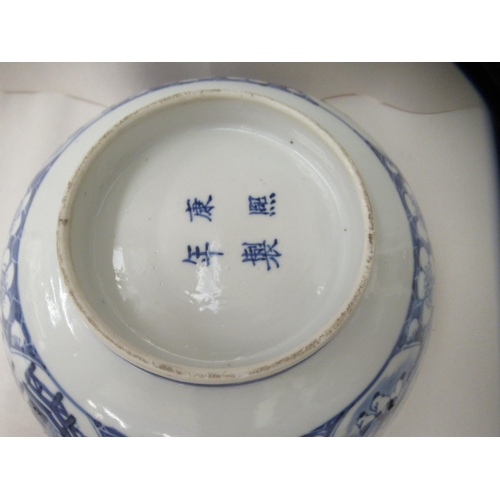 265 - A 19thC Chinese porcelain bowl, decorated with figures and flora  bears a four character mark  8.5