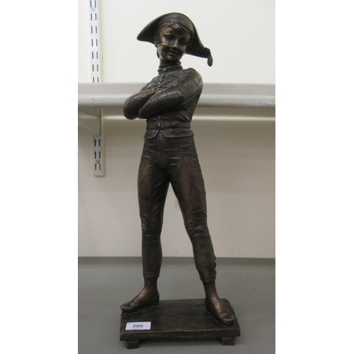 266 - A modern bronze effect figure, a young pirate with arms folded  19