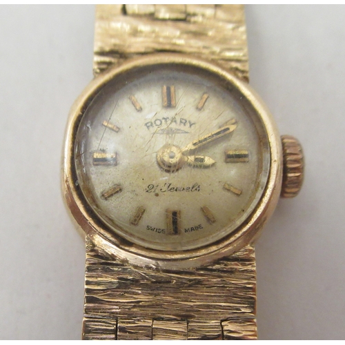 267 - A lady's Rotary 9ct gold case and strap wristwatch, faced by a baton dial