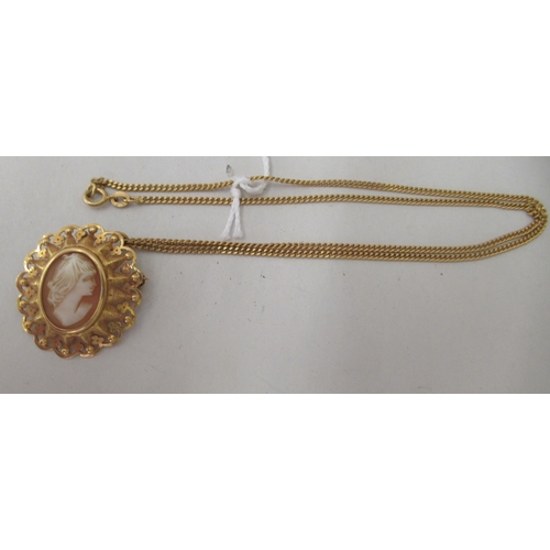 268 - An 18ct gold curb link neckchain with a yellow metal pendant, set with a shell carved cameo