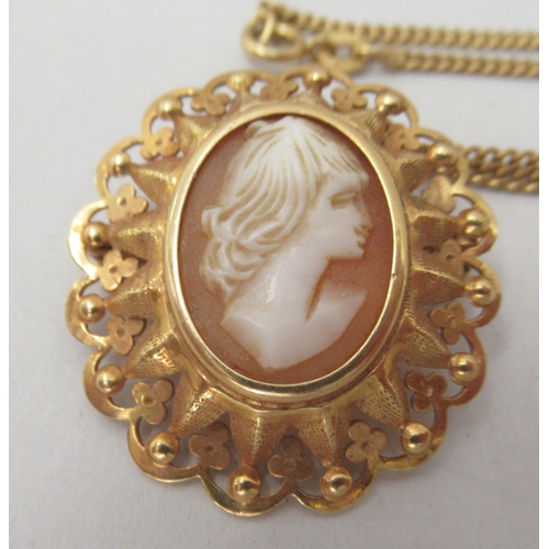 268 - An 18ct gold curb link neckchain with a yellow metal pendant, set with a shell carved cameo