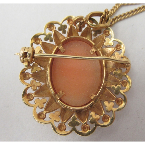 268 - An 18ct gold curb link neckchain with a yellow metal pendant, set with a shell carved cameo