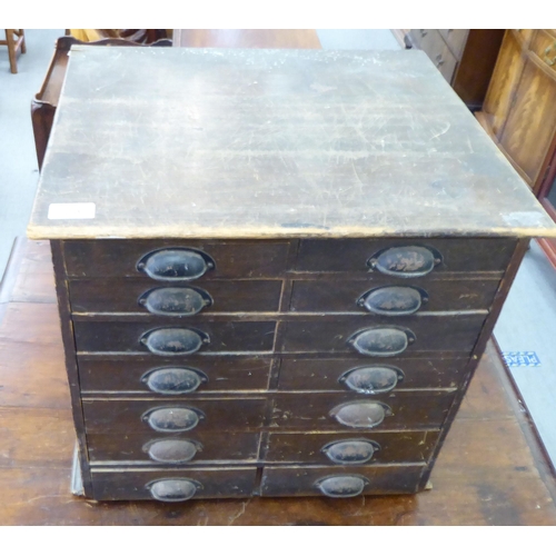 274 - An early 20thC stained pine fourteen drawer, table top collector's cabinet, on a plinth  17