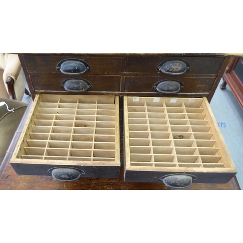 274 - An early 20thC stained pine fourteen drawer, table top collector's cabinet, on a plinth  17