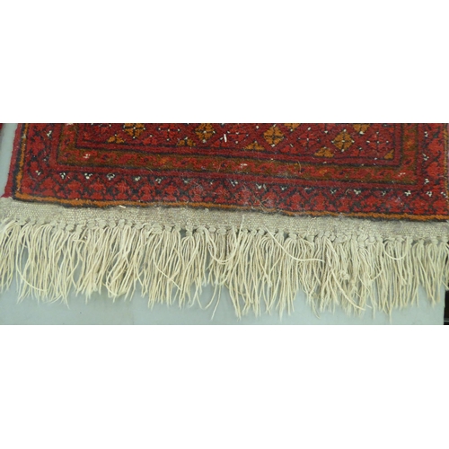 44 - Rugs: to include a Bokhara with a pole medallion, on a red ground  70