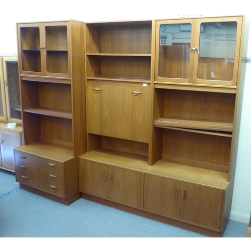 66 - Six G-Plan teak finished modular livingroom units, comprising an arrangement of cupboards, drawers a... 