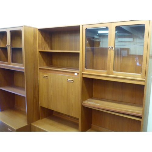 66 - Six G-Plan teak finished modular livingroom units, comprising an arrangement of cupboards, drawers a... 