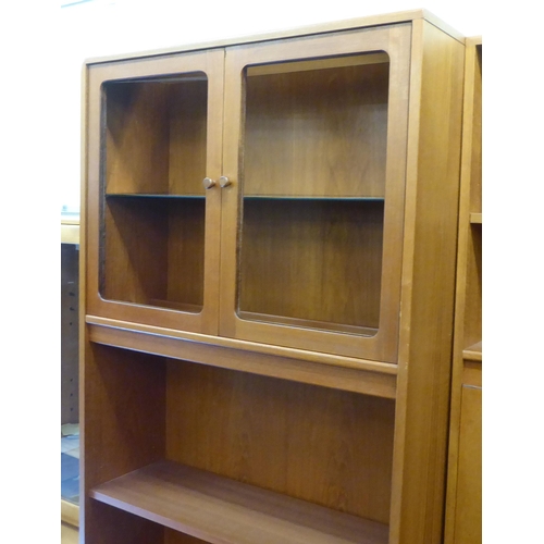 66 - Six G-Plan teak finished modular livingroom units, comprising an arrangement of cupboards, drawers a... 